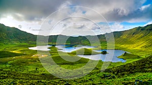 Landscape sunset view to Caldeirao crater, Corvo island, Azores, Portugal photo