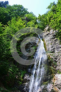 Landscape with Sutov waterfall, one of the tallest waterfalls in Slovakia, during summer season.