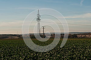 Landscape in swabian alb with powerlines and windmills