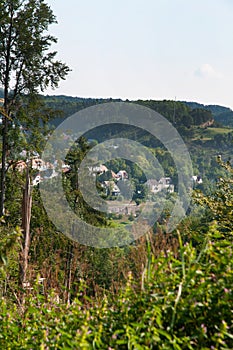 Landscape in swabian alb with village at hill slope
