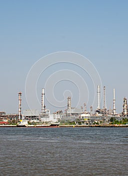 Landscape of Thai Refinery industrial plant from opposite's side of Chao Phra Ya river