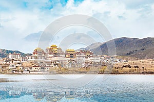 Landscape with tibetan monastery and lake in china