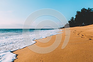 Landscape of tidal wave on the beach, gold sand, blue sky. Thailand