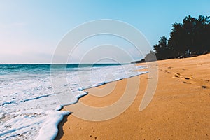 Landscape of tidal wave on the beach, gold sand, blue sky. Thailand