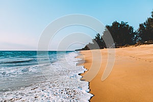 Landscape of tidal wave on the beach, gold sand, blue sky. Thailand