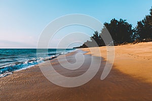 Landscape of tidal wave on the beach, gold sand, blue sky. Thailand