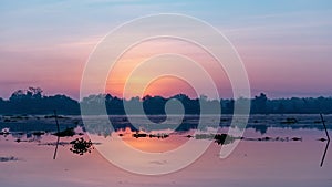 Landscape timelapse of beautiful sunrise or sunset sky over lake with reflection light in the water.