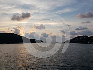 landscape with the tip of the island of La Roqueta in Acapulco bay at dusk photo