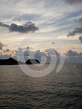 landscape with the tip of the island of La Roqueta in Acapulco at dusk photo