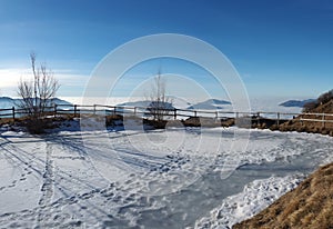 Landscape to the Po plain and Farno Mountain. The fog covers all the villages and the Padana plain