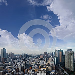 Landscape of tokyo city skyline in Aerial view with skyscraper, modern office building and blue sky background in Tokyo metropolis
