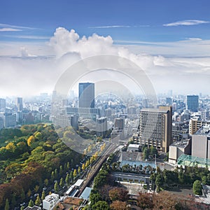Landscape of tokyo city skyline in Aerial view with skyscraper, modern office building and blue sky with cloudy sky background in