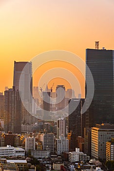 Cityscape of tokyo city skyline in Aerial view with skyscraper, modern office building and sunset sky background in Tokyo
