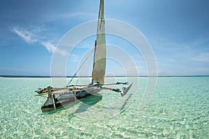 Landscape with traditional sail boat on tropical sea beach isolated in Diani Beach, Watamu, Zanzibar Maldives Caribbean sea