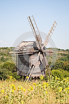 Landscape with traditional Ukrainian windmills houses in countryside village. Windmill mill at rural outdoor. Wind mill. Windmill