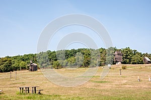 Landscape with traditional Ukrainian windmills houses in countryside village. Windmill mill at rural outdoor. Wind mill. Windmill