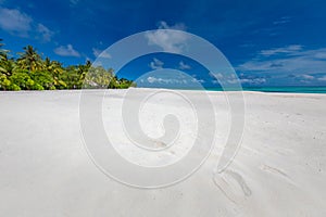 Landscape of tranquil island beach, soft white sand, blue sunny sky. Exotic tropical island shore