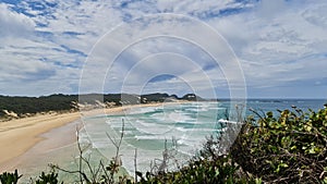 Landscape of Treachery Heaads surrounded by the sea and greenery in Australia