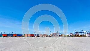 Landscape of truck, containers and crane at trade port