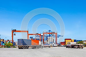 Landscape of truck, containers and crane at trade port