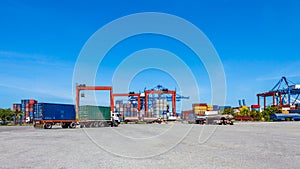 Landscape of truck, containers and crane at trade port