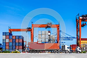 Landscape of truck, containers and crane at trade port