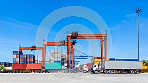 Landscape of truck, containers and crane at trade port