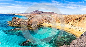 Landscape with turquoise ocean water on Papagayo beach photo