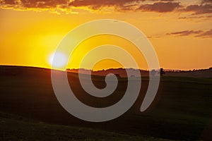 Landscape of tuscan countryside at sunset