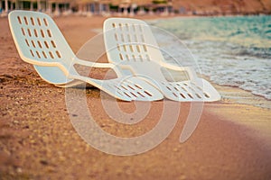 Landscape of Two Lonely beachchairs near the sea photo