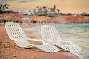 Landscape of Two Lonely beachchairs near the sea photo