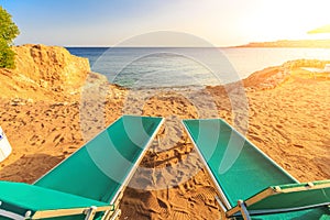 Landscape of Two Lonely beachchairs on the sand near sea photo