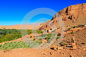 Landscape of a typical moroccan berber village with oasis in the