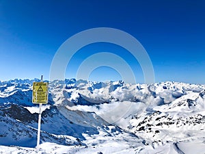 Landscape of Val Thorens Ski resort in France with glacier mountains under blue sky