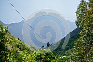 Landscape of a valley with a mountain in the distance in HuascarÃ¡n National Park