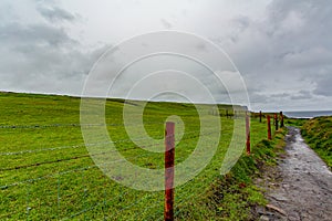 Landscape of a valley with a trail from Doolin to the Cliffs of Moher