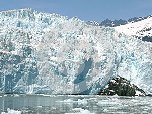 A landscape of the vertical wall of a massive glacier