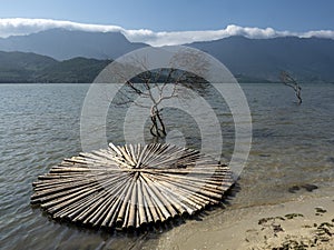 Landscape  with mountains, sea, sun and traditional attributes photo