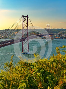 Landscape view on the 25th of April Bridge during the sunset in Lisbon city, Portugal