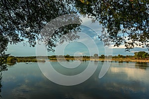 Landscape view on the banks of the Okavango River, Caprivi, Namibia photo