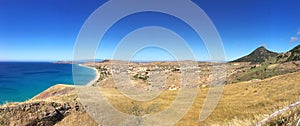 The landscape view of the beach at Porto Santo with the shadow of Madeira in the background photo