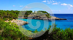 Landscape view of a boat in a beautiful bay, Mallorca island, Spain