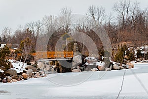 Landscape view of the bridge at the japanese garden in the Frederik Meijer gardens in winter