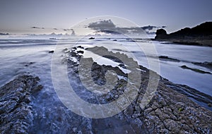 A landscape view of Broad Haven beach at dusk and sunset in Broad Haven, Pembrokeshire, Wales, UK. Taken in July 2014