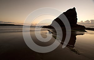 A landscape view of Broad Haven beach at dusk and sunset in Broad Haven, Pembrokeshire, Wales, UK. Taken in July 2014