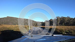 Landscape view from a car of Cradle Mountain Lake-St Clair National Park in Tasmania Australia 02