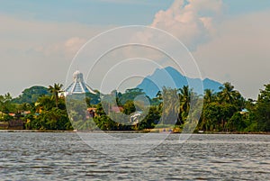 Landscape view of the city and Sarawak river. Museum of cats, and a mountain on the horizon. Kuching, Borneo, Malaysia