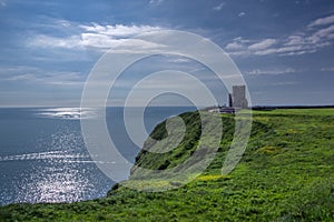 Landscape view of Cliffs of Moher and O`brien`s tower with clear