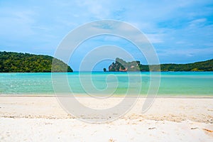 Landscape view of coastline with limestone rock and boats on ocean at Ko Phi Phi islands, Thailand. Concept of exotic tropical