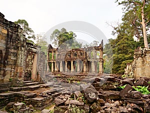 Landscape view of demolished stone architecture at Preah Khan temple Angkor Wat complex, Siem Reap Cambodia. A popular tourist